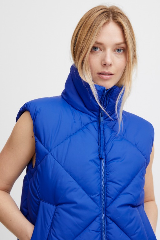 VESTE SANS MANCHES COURTE UNIE